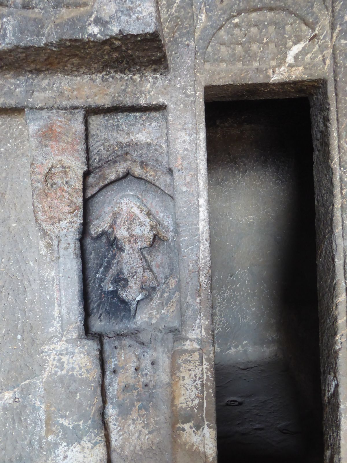 At some later date, a deity has been carved in the back wall.