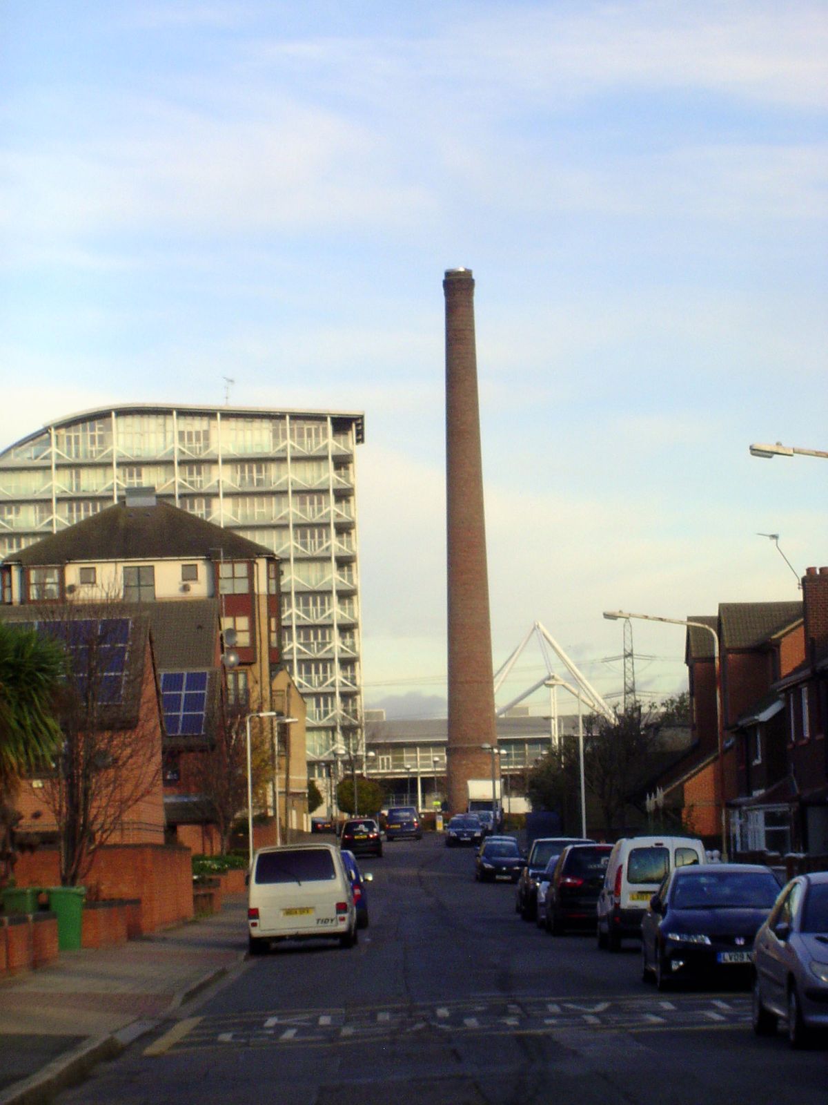 We'll circle counter-clockwise around the dock and arrive back at our starting point. Here, the surviving chimney of the Empire Mills, from 