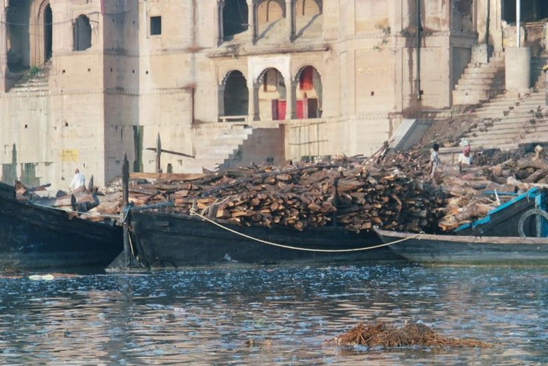 Boatloads of firewood heading to the cremation ghats.