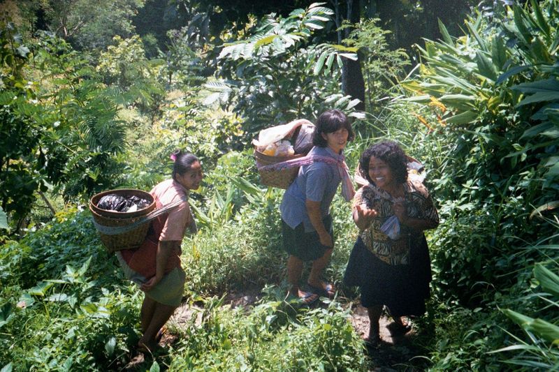 People live up here. A few women come home with their shopping.