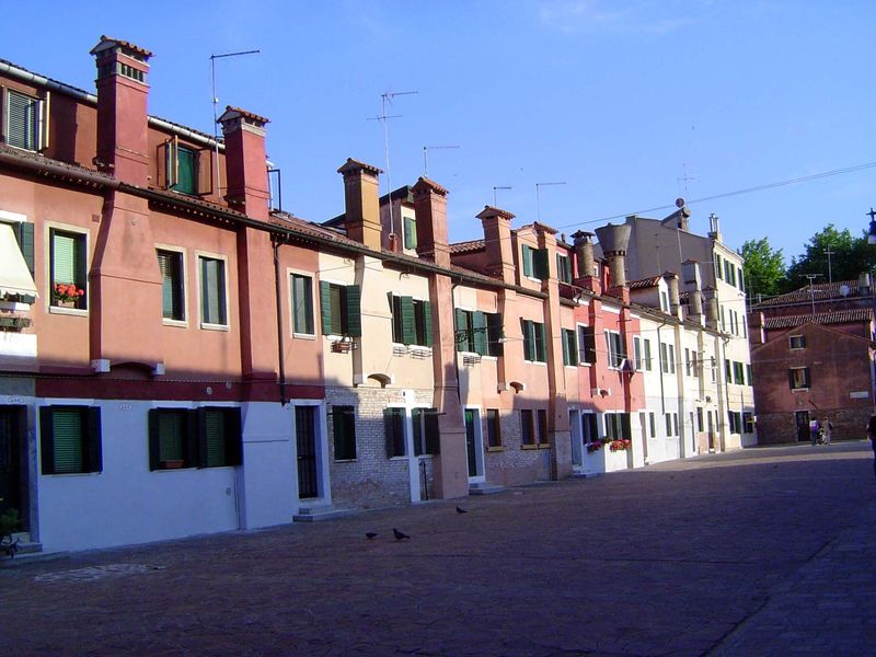We pass some low-rise buildings.