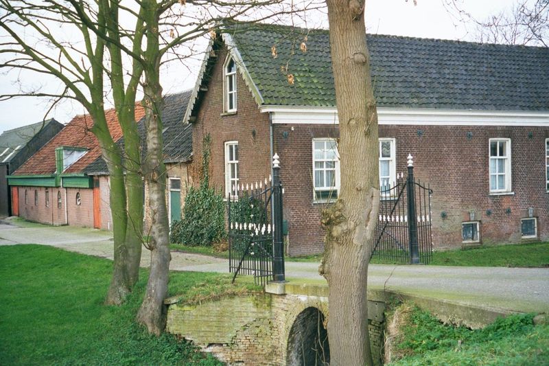 Another farmstead, with a row of connected buildings.