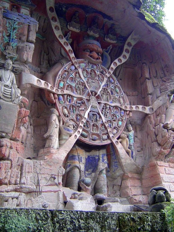 The carvings quickly become dramatic, not to say terrifying. Here, the demon Mara holds the Wheel of the Law in his teeth, as if to suggest 