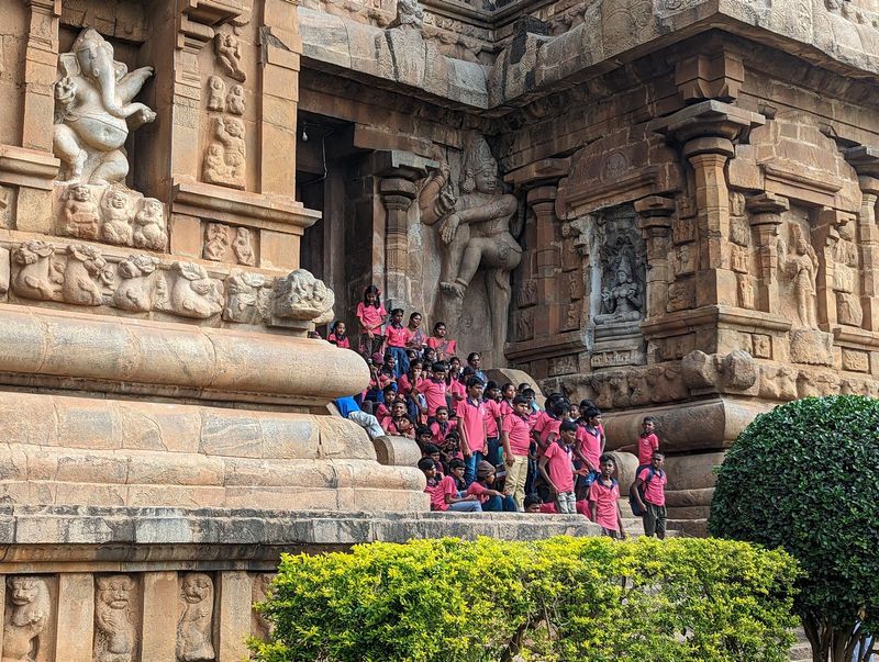 The kids aren't the least bit alarmed by the dvarapala.