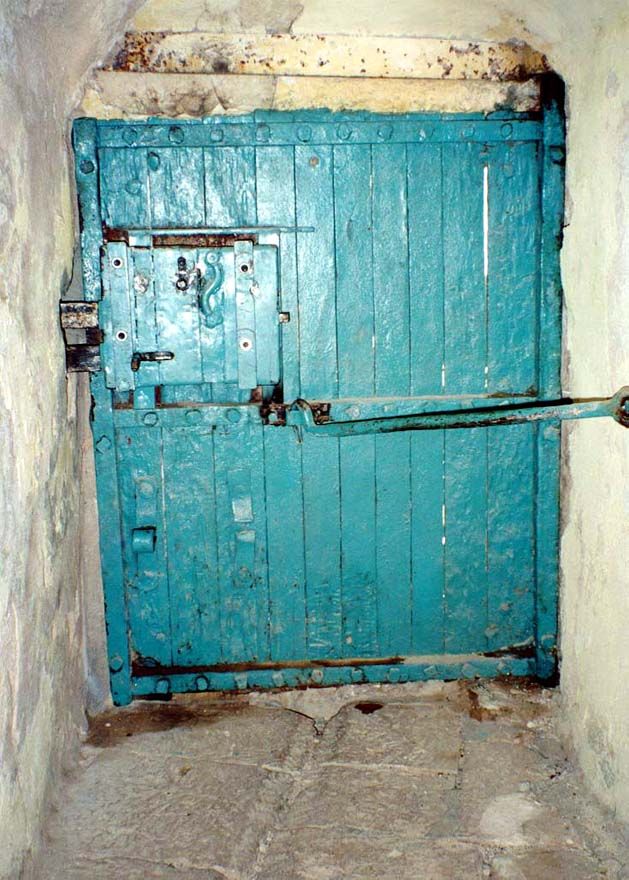 A companion door at the base of the monastery and opening to Wadi Nar and, in a small cave, the trickle of freshwater that is the monastery 