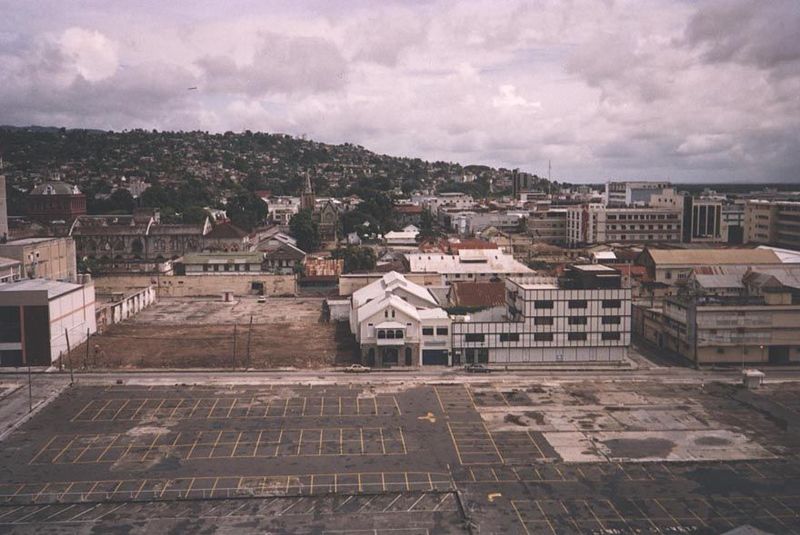 The city center lies in the mid-distance, where, just left-of-center the steeple of Trinity Cathedral may be discerned.