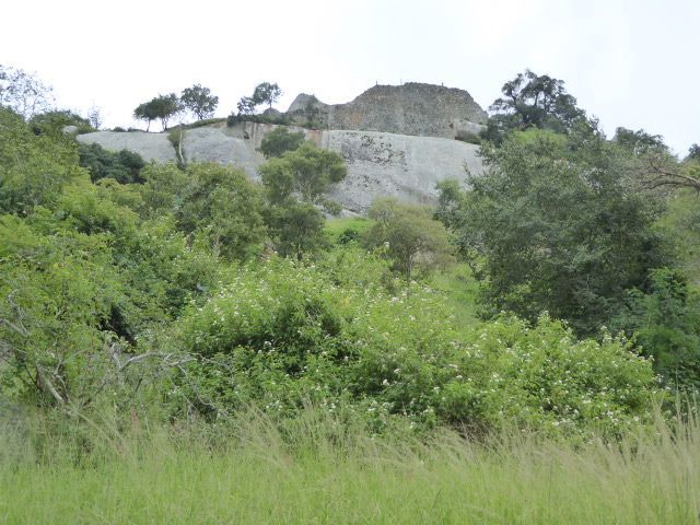 We'll start up the mountain, here zoomed from the base. The first outsider to visit and write about Great Zimbabwe was Karl or Carl Mauch, a