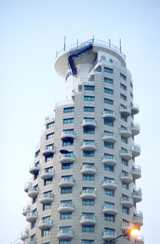 A cylindrical apartment building anticipates its own demise. that's what happens when you live surrounded by ancient ruins.