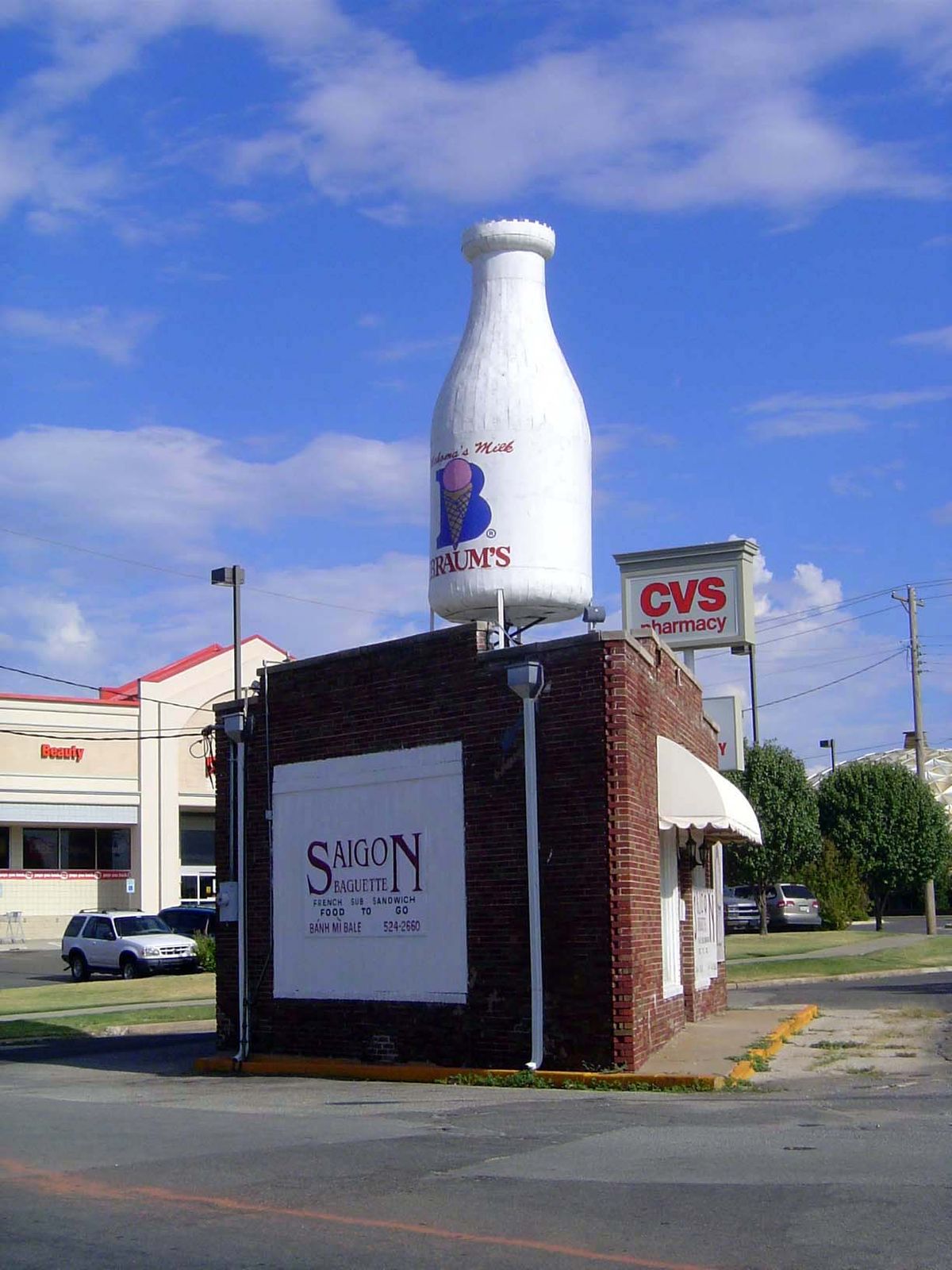 What else from the '30s? How about this? Known locally as the Milk Bottle Store, it opened in 1931 as Cooper's Cleaners. The little triangle