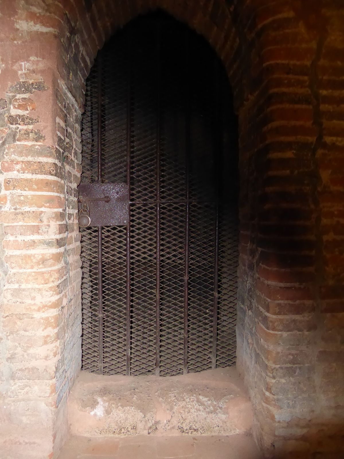 The shrine itself is locked and dark. Maybe you'll have better luck and be able to see what's inside, if anything.