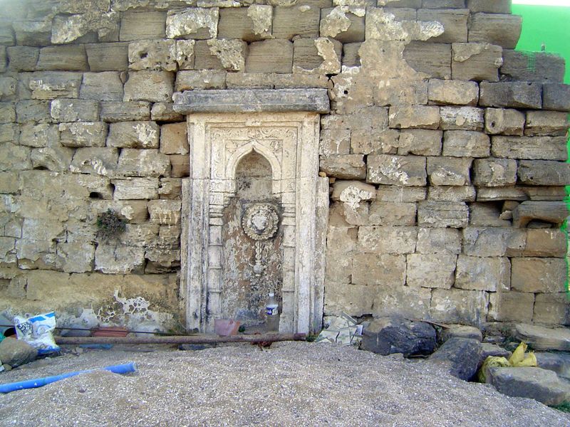 Pardon our construction, but we're looking at an old prayer wall or namazgah and a mihrab or prayer niche carved from two blocks of stone un