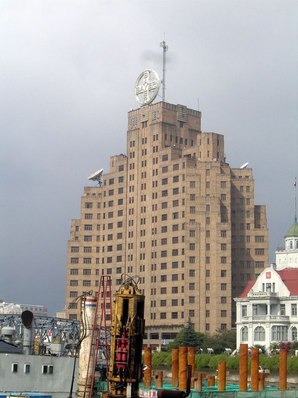 We're looking across Suzhou Creek, which flows east to join the Huangpu. The tall building is the Broadway Mansions hotel, built as an offic