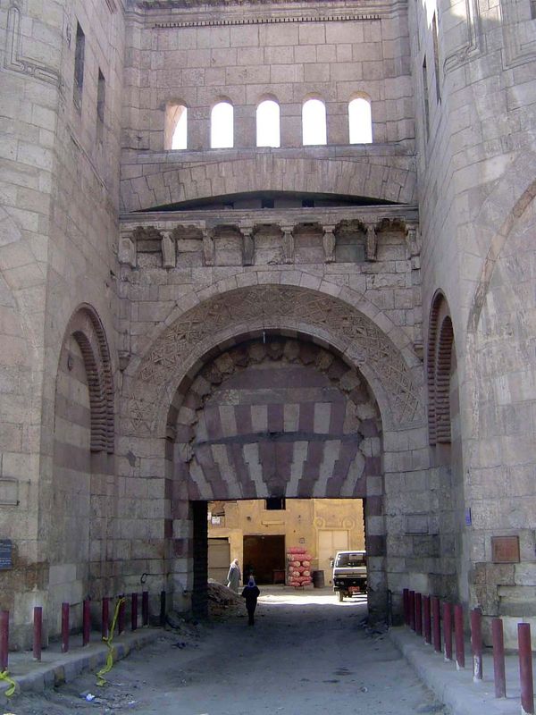 No. 6 The Bab al-Futah, "The Gate of Conquests," has round flanking towers instead of square ones. It's also the main entrance to the axial 