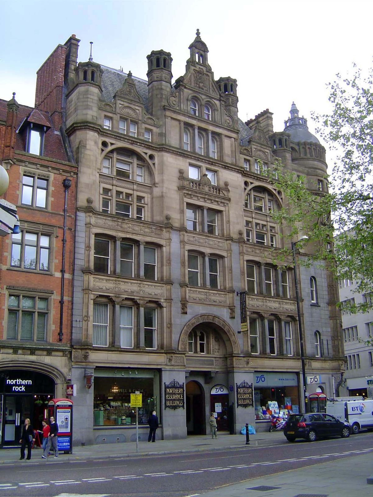 Commerce was never far away; here, across the street, is the office of the Northern Assurance Company.