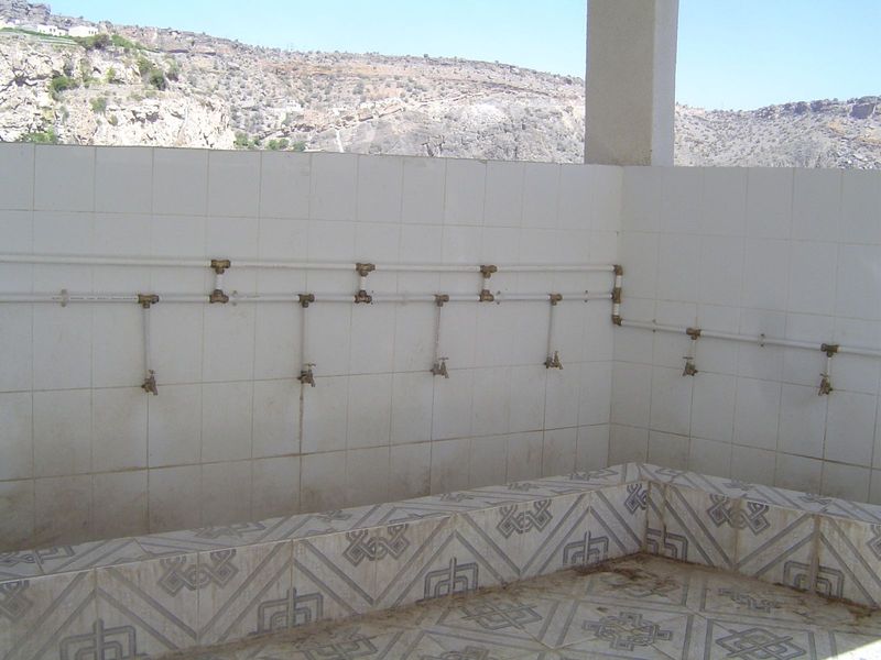 And here's the inside of the structure. It's a place to wash, and it adjoins... well, any ideas?