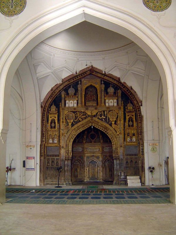 The mihrab has an inscription reading, "This gilding and ornamental work was done by order of the Sultan Muhammad Adil Shah, A.H. 1045." Tha