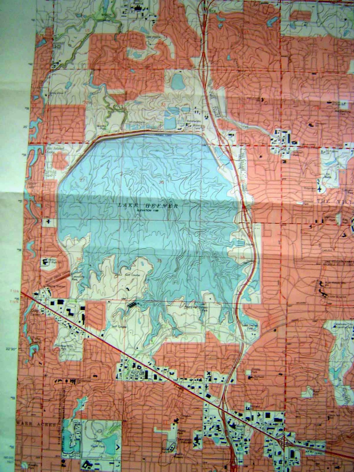 A later edition, everything a nice pink but with lots of brave new housing just downstream from the dam.