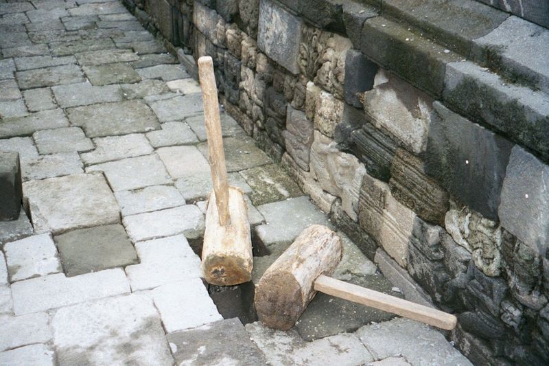 Rebuilt by the Dutch and again, more thoroughly, by the Indonesians, Borobudur still needs maintenance. New andesite blocks are still stockp