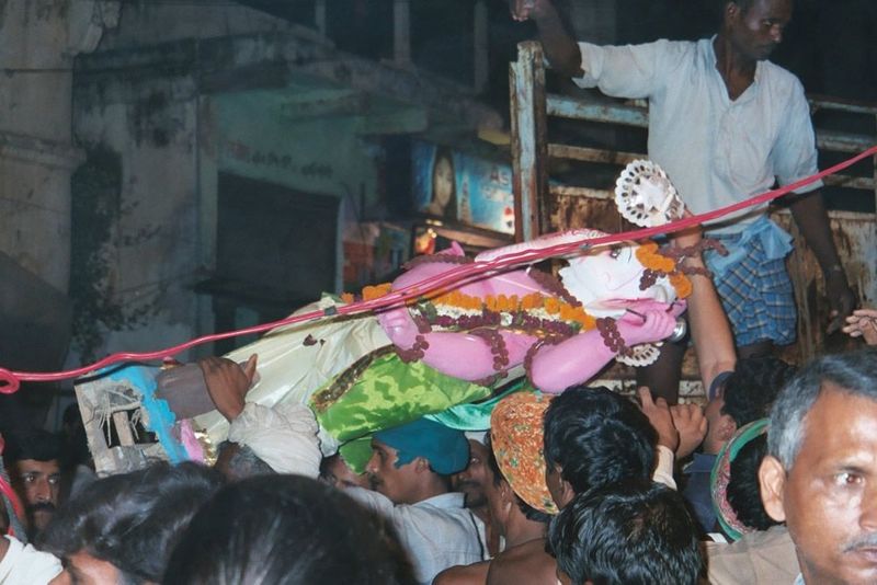A Ganesh is offloaded near the river.