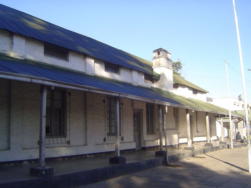 The boma or government quarter was less than a mile away. It was very modest, with everything one-story, red-brick, and with metal roofs pai