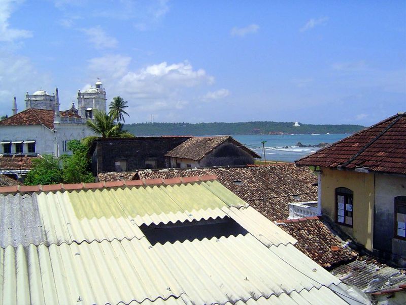 The opposite view, past the mosque and across Galle Harbor. A steady and cooling sea breeze blows.