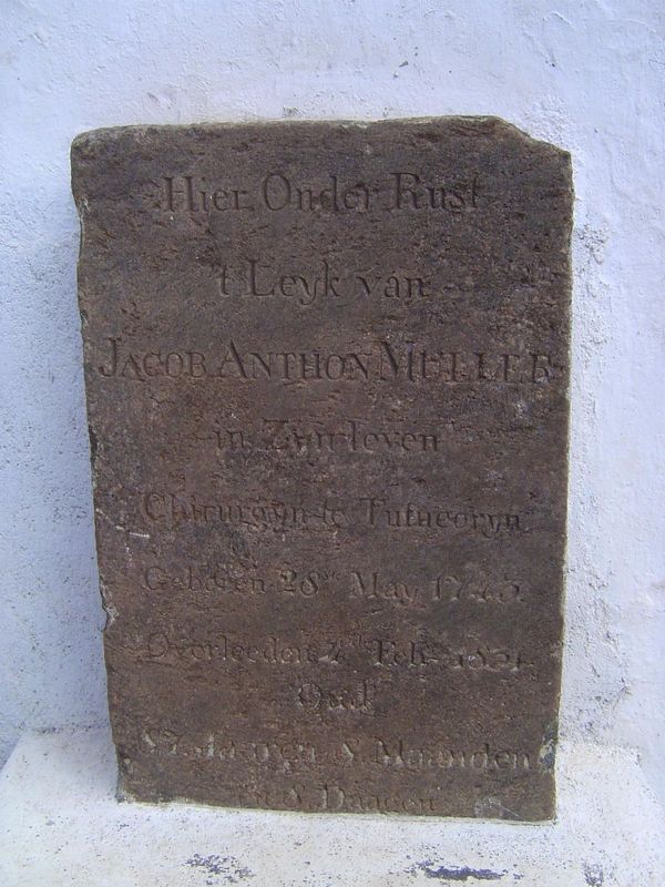 A tombstone now attached to the wall of the church: "Here rests the body of Jacob Anton Muller, in his lifetime Surgeon of Tutucorin, born 2