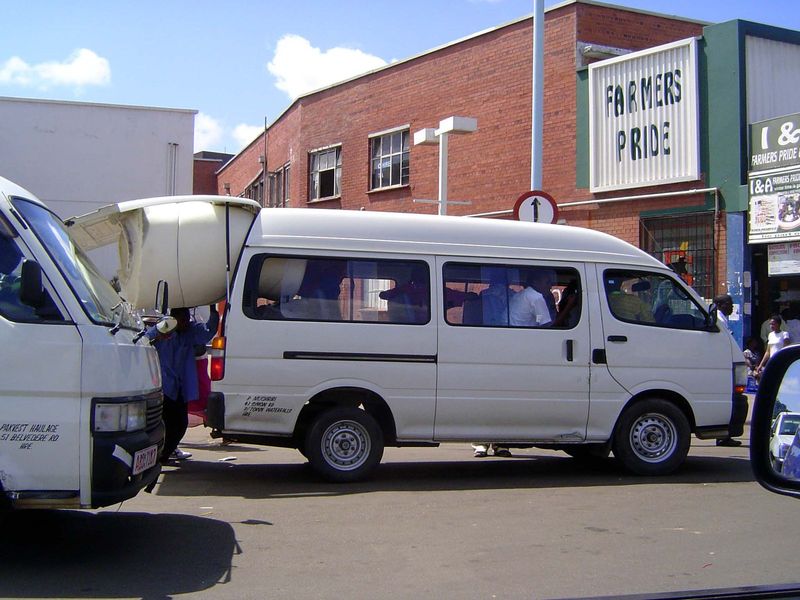 Parts of the city are almost as crowded and a lot more lively. Here, minivans leave for surrounding villages; one turns into a moving van fo