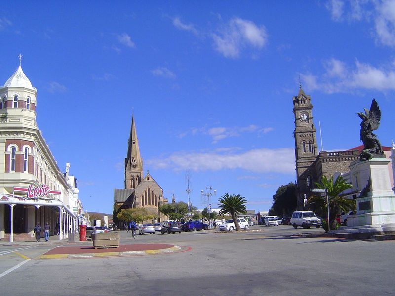 The view grows somber with the dark Cathedral of Saints Michael and George and the town hall. Its clock tower was conceived as a memorial to
