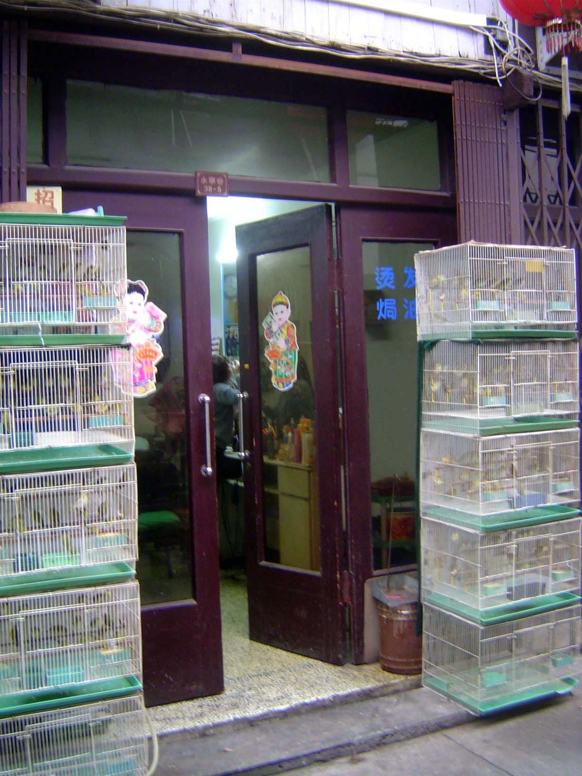 Birds in cages.