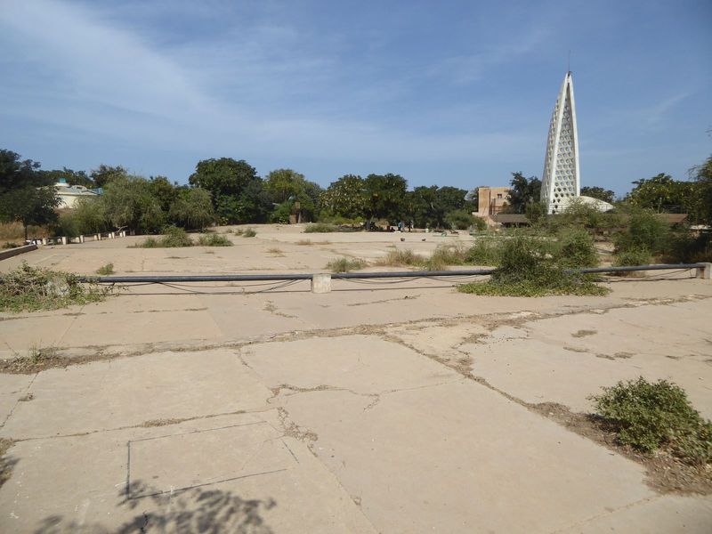 The summit is paved, a relic of World War II fortifications. The slave-trade monument, suggestive of Dubai's Burj al Arab Hotel, was complet