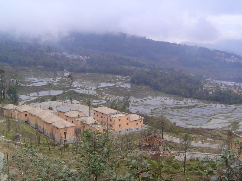 Here's another village, not one that does much to improve the beauty of the terraces. The roofs may well get a cosmetic layer of thatch.