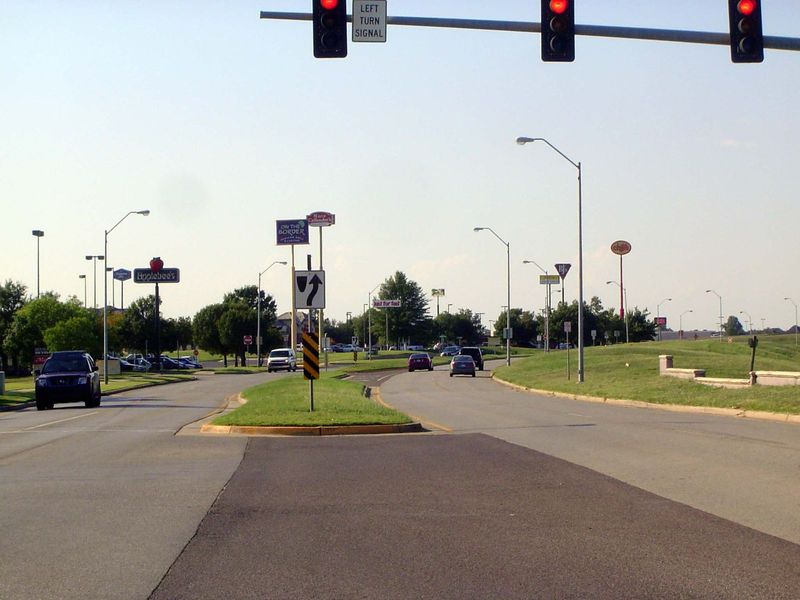 South of the mall, Ed Noble Parkway runs between Interstate 35 and a big-box and casual-dining lineup.