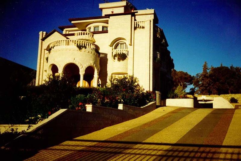 A lifetime later, villas are still being built. The cylindrical arcade supports an inaccessible balcony. No matter: no architect on the West