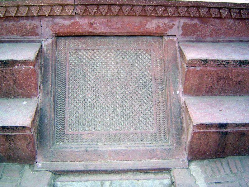 Water once babbled over this sloping stone. For a glimpse of what it looked like, see the rainy-day pictures of Akbar's tomb at Sikandra, ne
