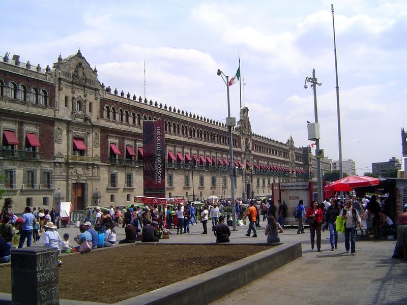 The National Palace, on the east side of the square, occupies the site of the residence of Cortés. Sold to the Crown in 1562, the building b