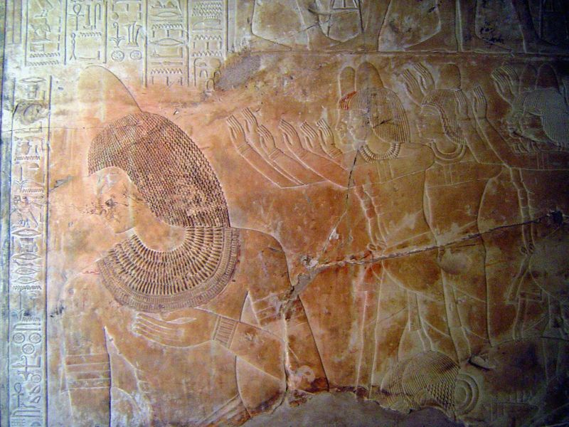 Khaemhet, on the left, bows before Amenophis III, whose image was moved long ago to Berlin. Behind Khaemhet, officials show their respect fo