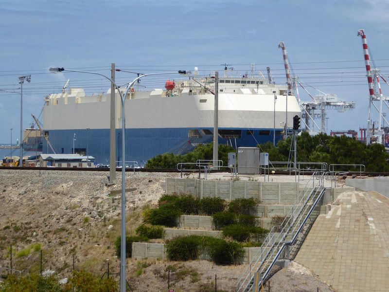 Car carriers must be the most ungainly vessels on the seas. This one is the Wisteria Ace, Liberian registered and delivering vehicles here, 