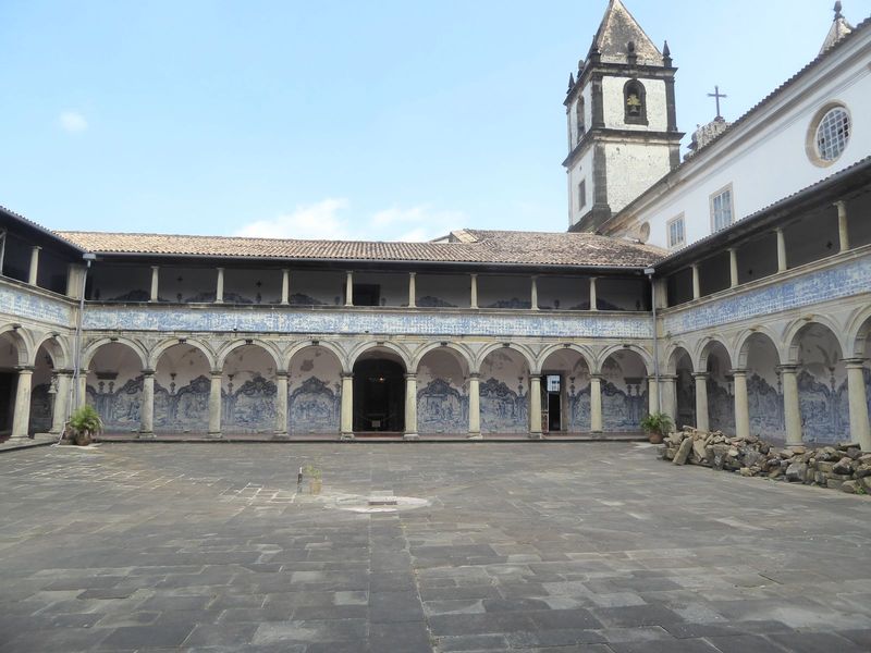 An interior courtyard is walled with Portuguese tiles.