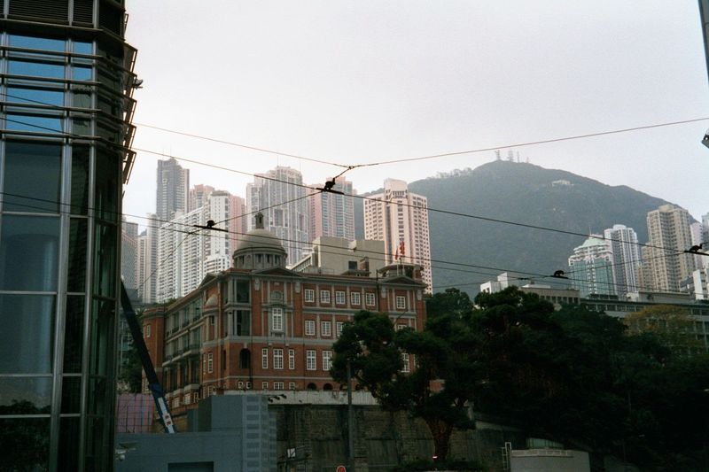 The old Court of Final Appeal, shown in relation to Victoria Peak and the residential towers of Mid-Levels.