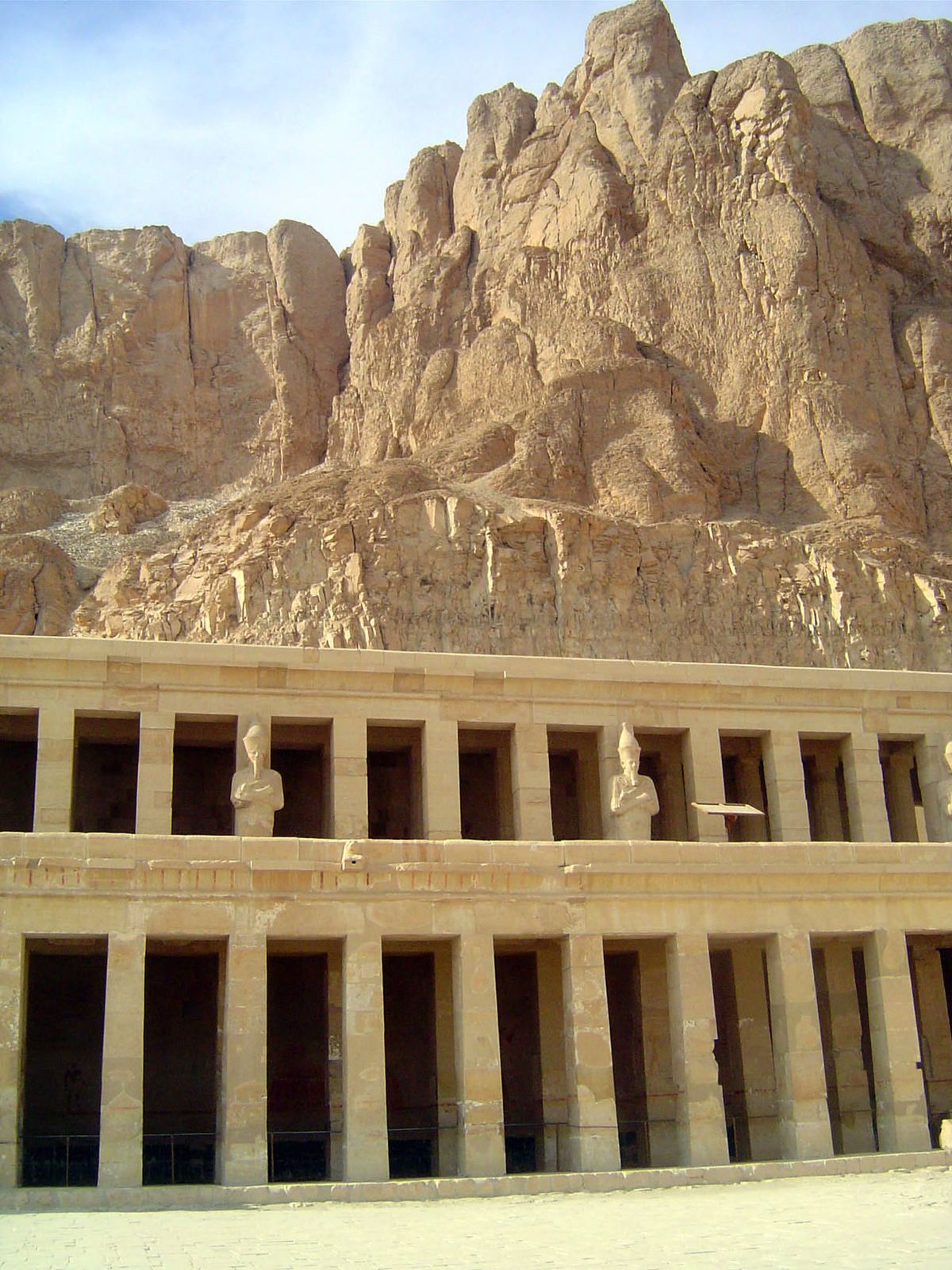 The middle and upper colonnades, the upper with statues of Hatshepsut as Osiris.