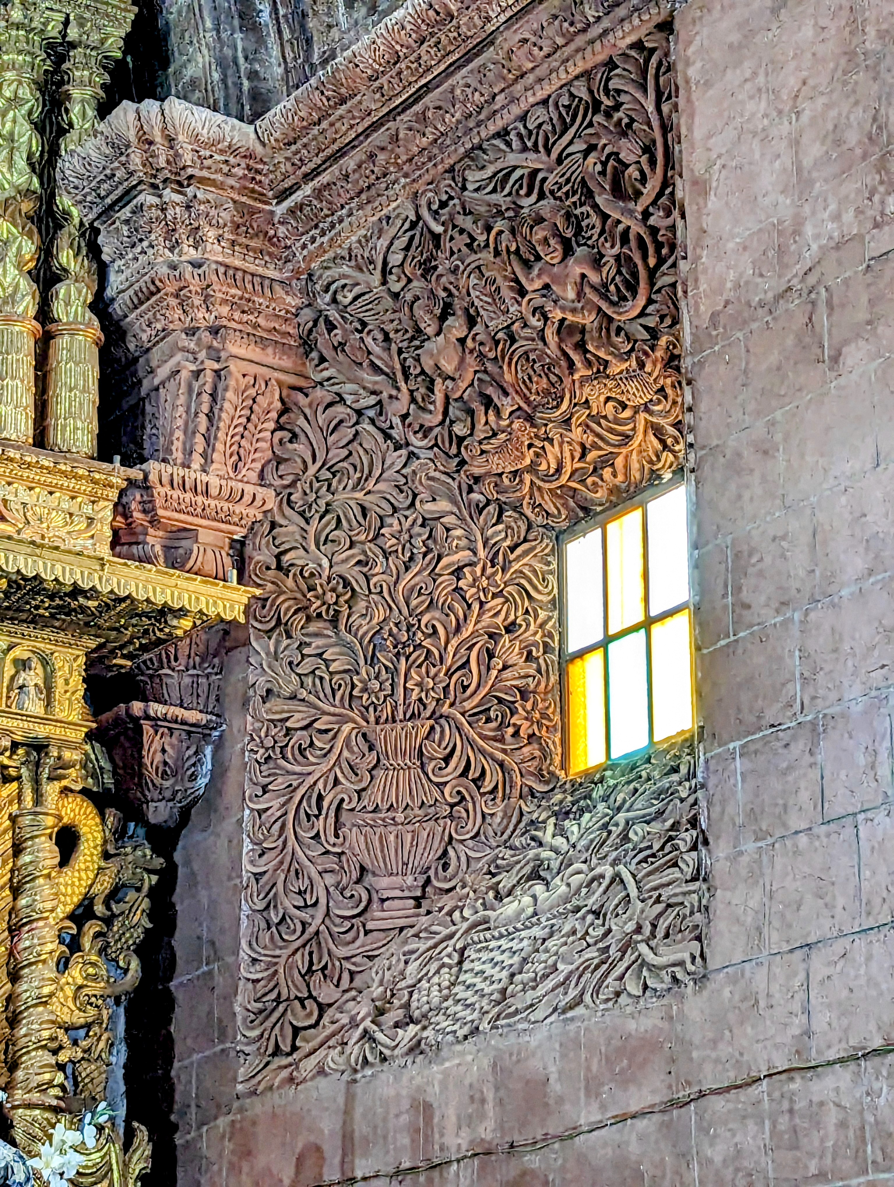 Splayed window at sides of altar.
