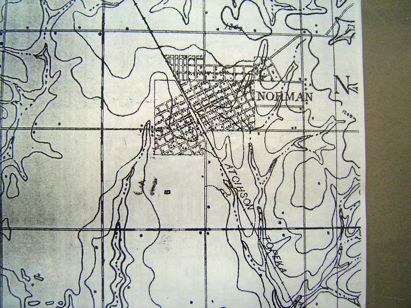 A U.S.G.S. topo sheet from 1893 shows the AT\&SF railroad and the original townsite grid of two quarter-sections oriented to the track. It s