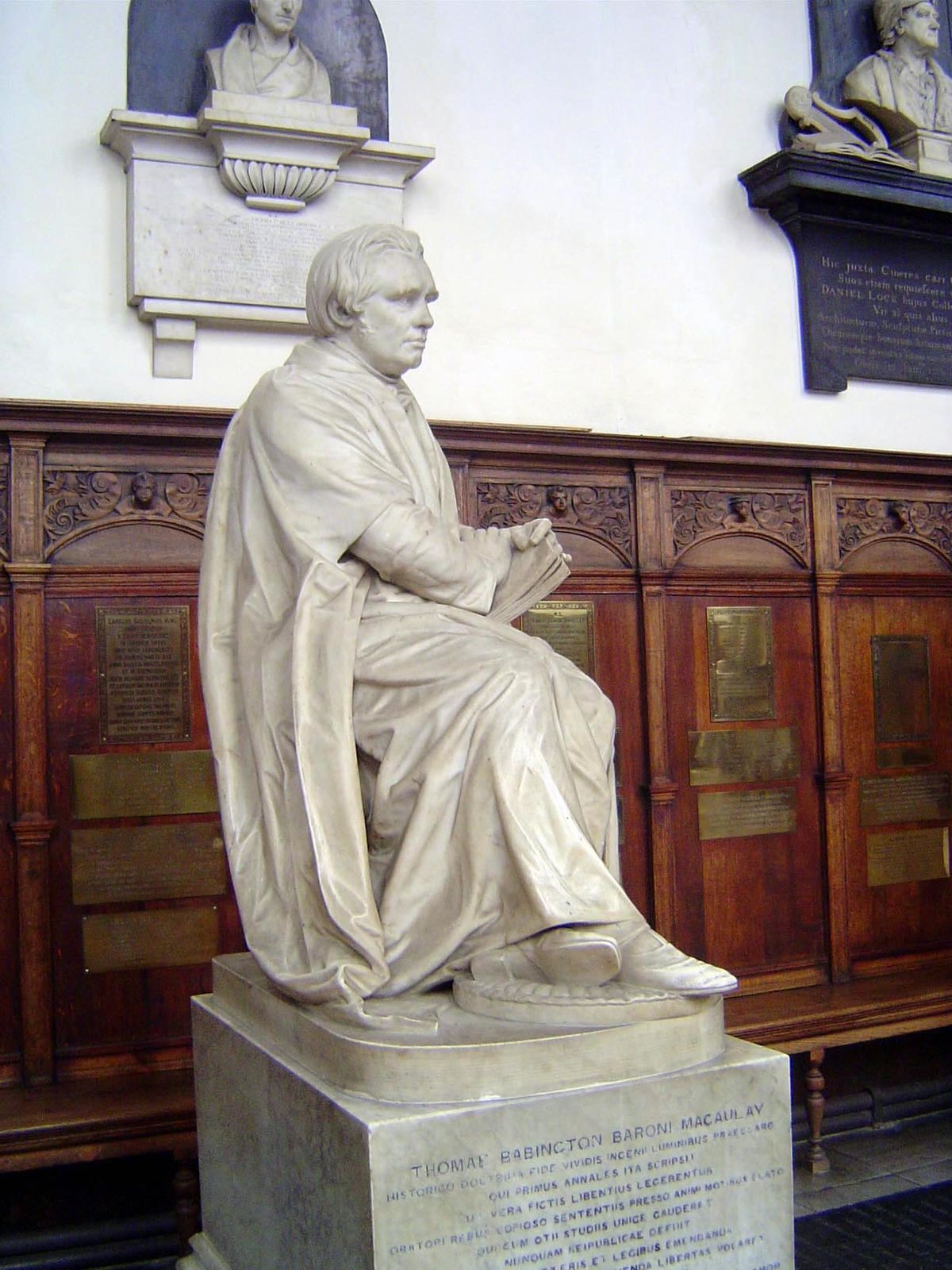 A great admirer of Bacon, Thomas Macauley sits opposite him.