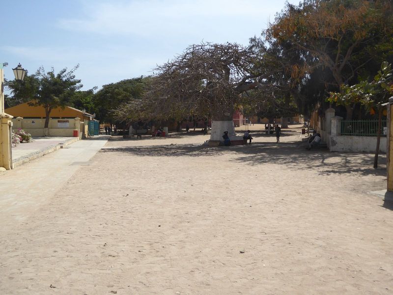 There's a sandy central plaza, decorated with Parisian lamp standards and baobabs.