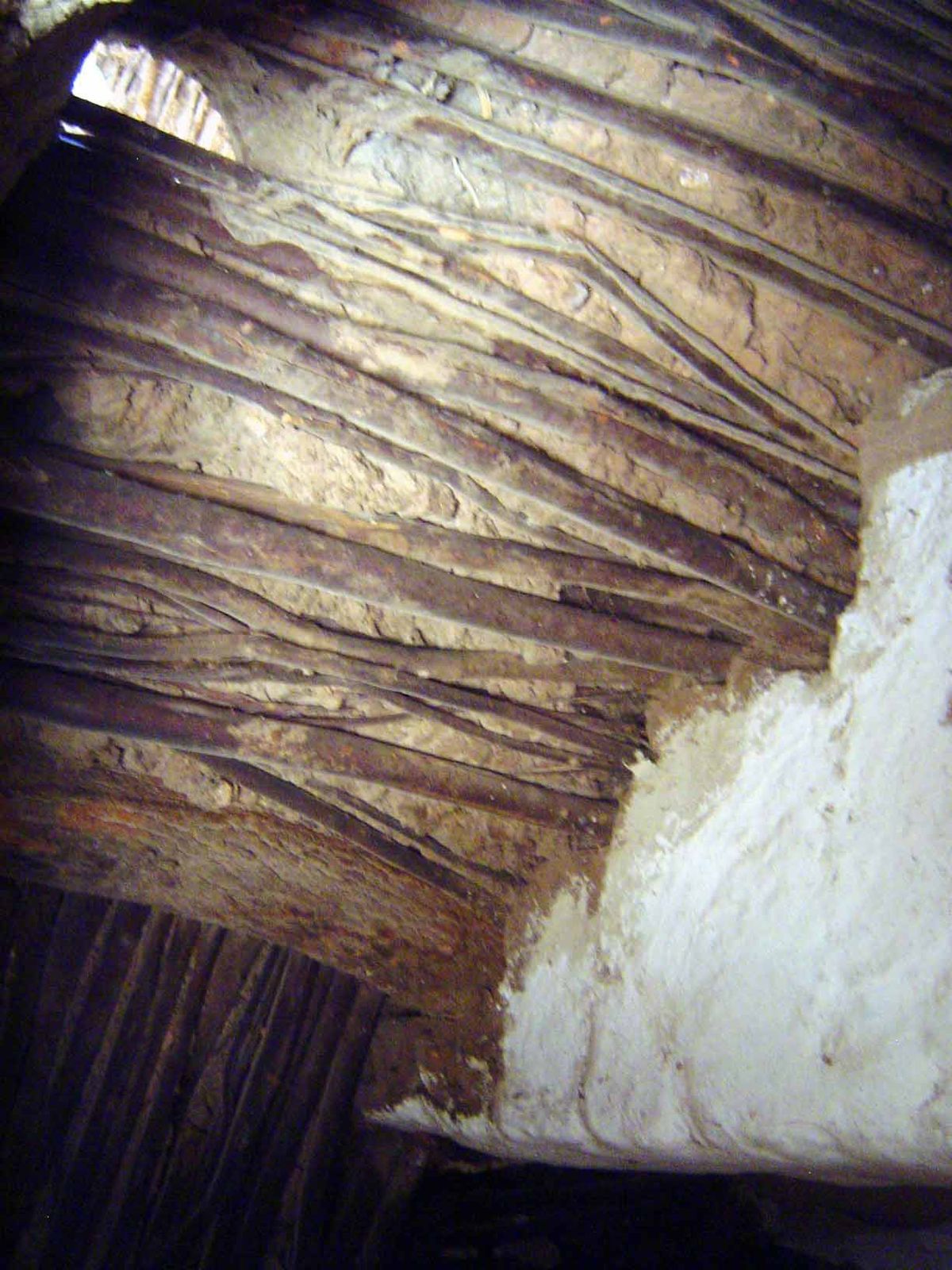 Looking up at the underside of an interior staircase.