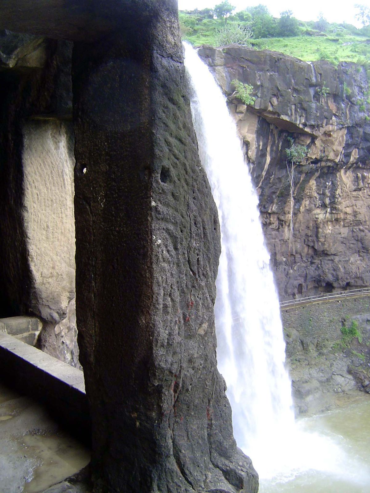 One of those caves opens next to the fall.