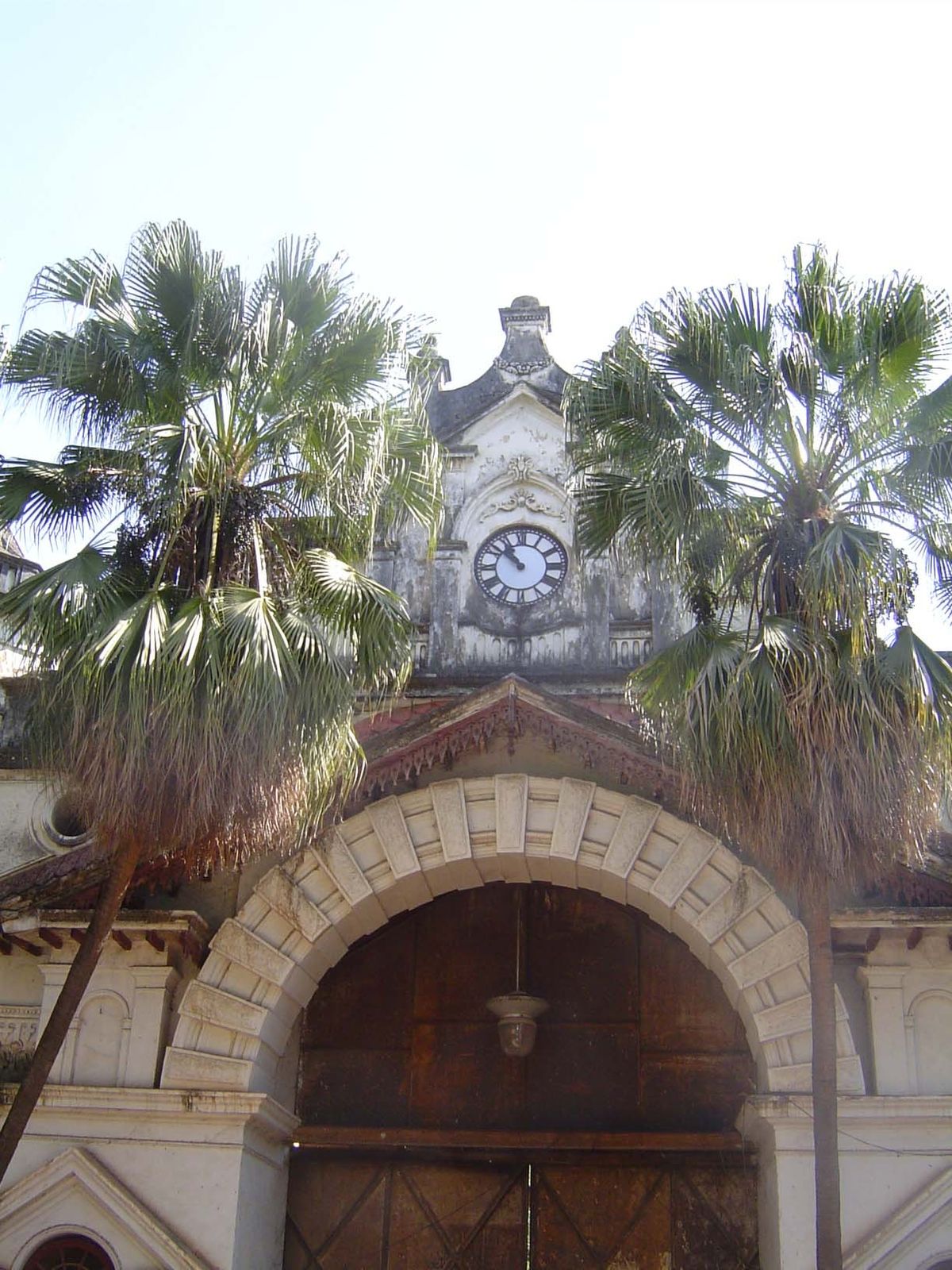 A side entrance, barred tight.