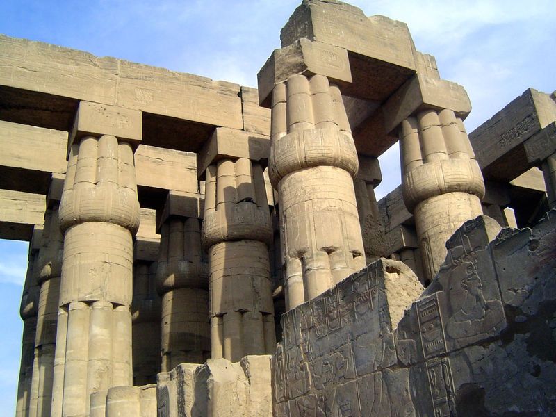 The Sun Court, measuring 146 x 166 feet, is bounded on the south by a flat-roofed or hypostyle hall with 32 fasciculated or papyrus-bundle c