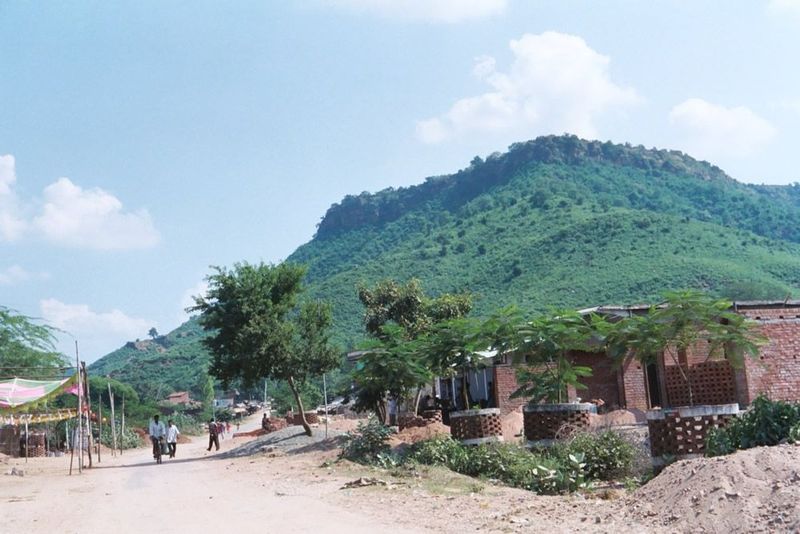 There's a small town at the base of the hill. From it, a road has recently been built up the far side of the hill, so access is very easy.