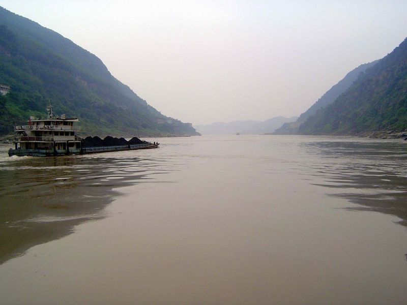 A barge heads towards the river's historic, now flooded gorges.